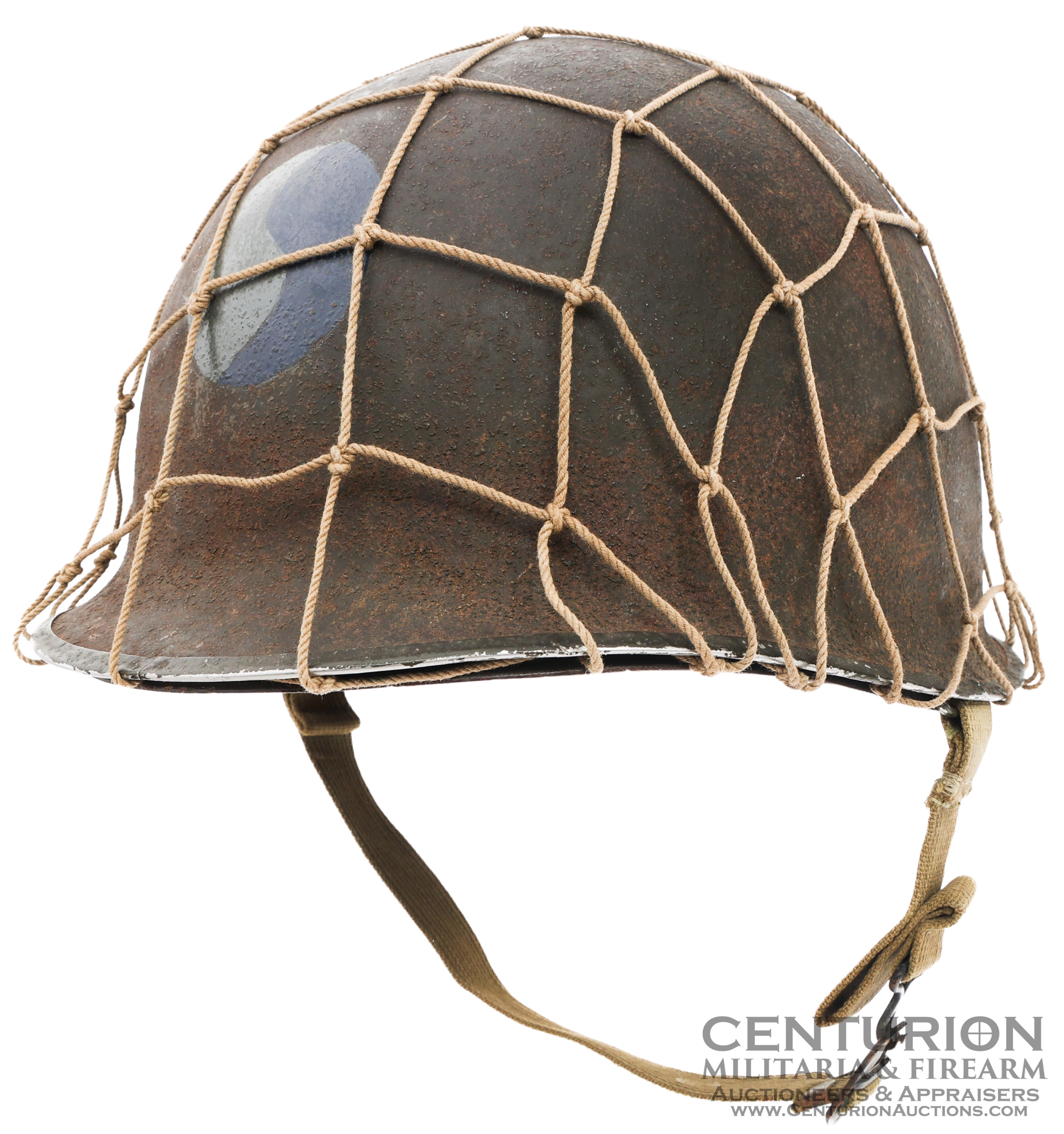 WWII US Army 29th Infantry M1 Combat Helmet. Front seam, Fixed bale with OD3 Chinstrap and Camouflage Netting 140059